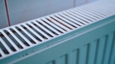 White iron radiator of convection type close-up. Smooth camera movement. Room heating in winter. High quality FullHD footage
