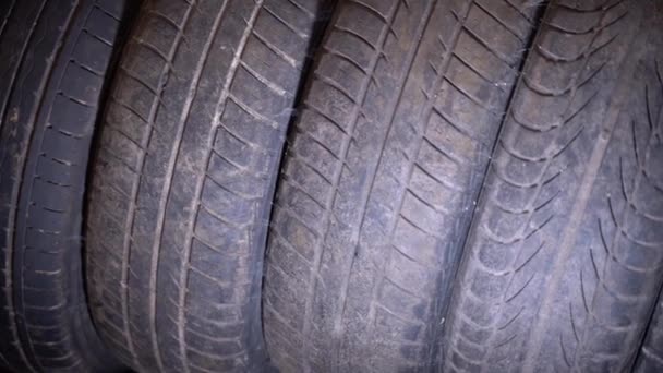 Old Worn Car Tires Stacked Warehouse Close Smooth Camera Movement — Vídeos de Stock