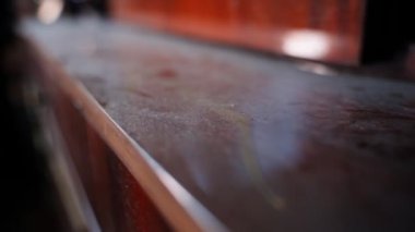 Dusty wooden lacquered surface close-up, smooth camera movement. High quality FullHD footage