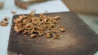 Walnut shell on a wooden board close-up. Smooth parallax. High quality FullHD footage