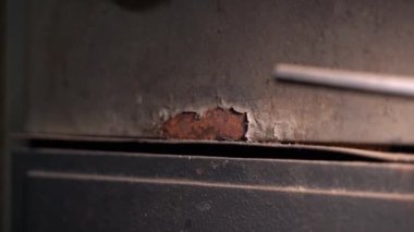 Spot of rust on a gray metal part. Corrosion from damage and temperature changes and moisture. Smooth parallax. High quality FullHD footage