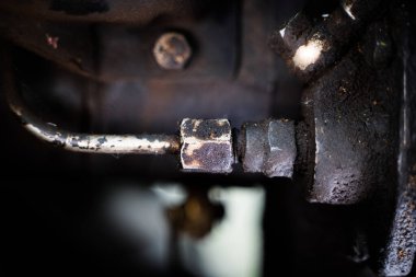 Rigid connection of an aluminum branch pipe with the engine case. Oiled engine assemblies close-up