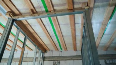 U-profile frame for plasterboard walls. Building a room within a room. Bare walls in a private house. Smooth camera movement. High quality FullHD footage