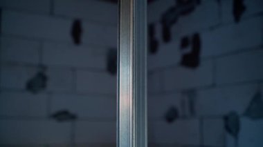 Metal U profile close-up at a construction site in the evening. Metal Channel frame. High quality FullHD footage