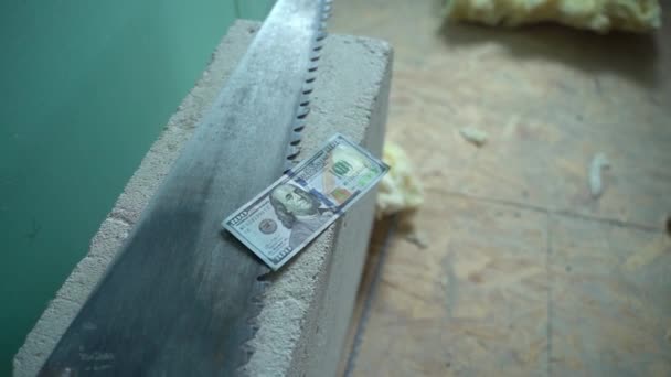 One Hundred Dollars Lies Hand Saw Aerated Concrete Money Hacksaw — Stockvideo