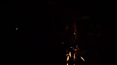 Sparks from sharpening a knife in the dark close-up in slow motion. High quality FullHD footage