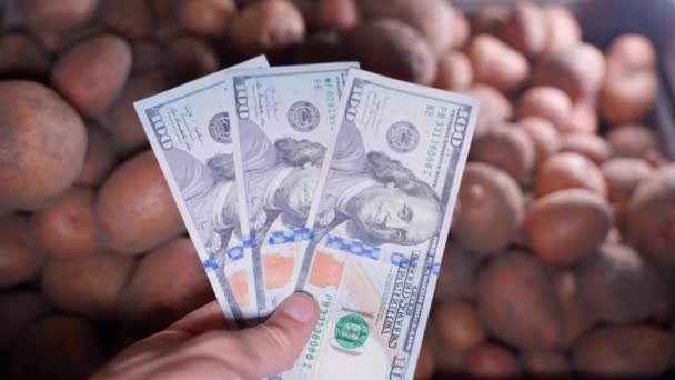 Hand Removes Three Hundred Dollars Foreground Background Mountain Red Potatoes — Stock Video