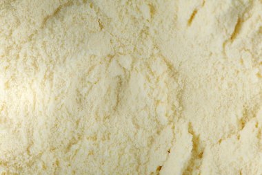 Sarı kuru bebek maması dokusu, süt tozu. Üst Manzara. Düz yatıyordu