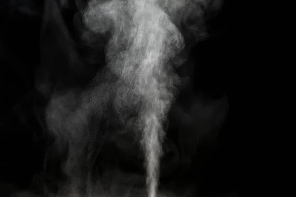 Water vapor on black close-up. view of white water vapor