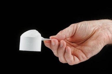 Scoop with protein in hand