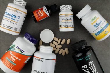 LVIV, UKRAINE - February 06, 2023: Vitamins and dietary supplements lie on the table