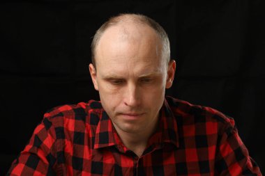 Caucasian man bowed his head in depression