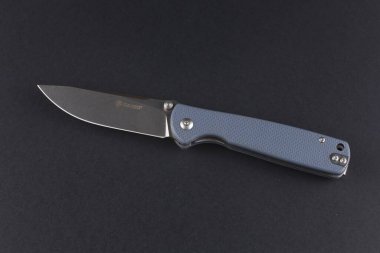 LVIV, UKRAINE - 08 Aralık 2023: Katlanan bıçak Ganzo G6805