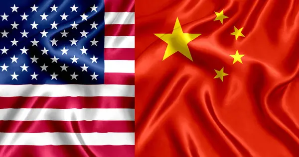 stock image Flags of the USA and China waving side by side.