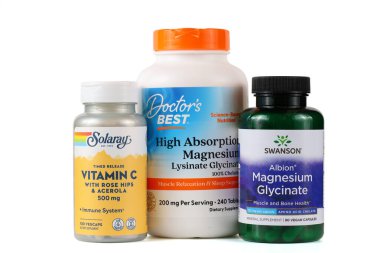 LVIV, UKRAINE - September 30, 2025: Three bottles of magnesium supplements are shown, now popular for health and wellness.