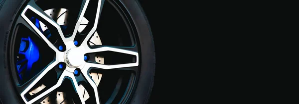 Closeup Racing Wheel Sports Car Black Background Panoramic Banner Copy — Stock Photo, Image