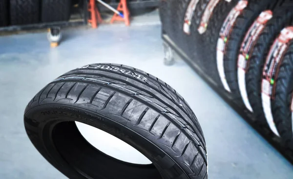 Car tire in a auto tire shop or car service center , Car tire shop and maintenance service concept