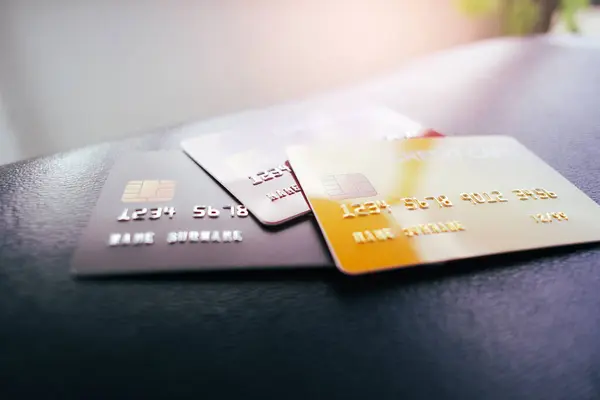 Credit or debit cards on leather table with a sunlight , selective focus , Finance and business concept
