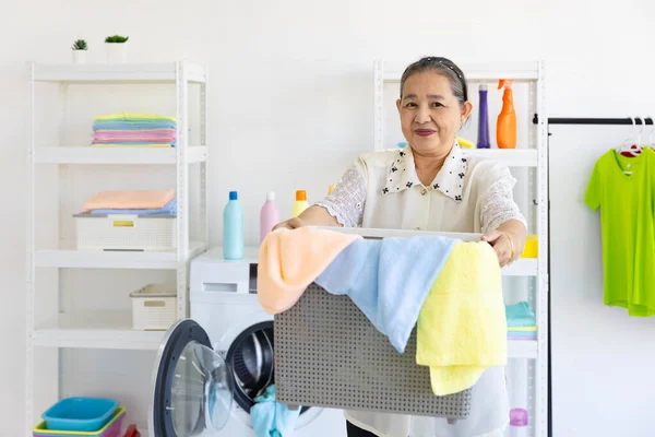Senior Woman Smile Preparing Load Dirty Cloth Washing Machine Laundry Fotos De Stock Sin Royalties Gratis