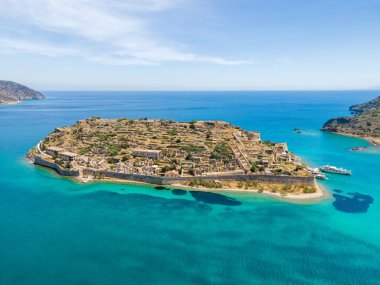 Aerial drone view of an old Venetian fortress island and former Leper colony. Spinalonga, Crete, Greece. clipart