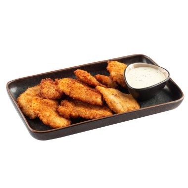 İzole edilmiş soslu tavuk nuggetları.