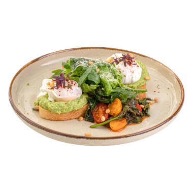 Bir porsiyon avokado tostu ve haşlanmış yumurta.