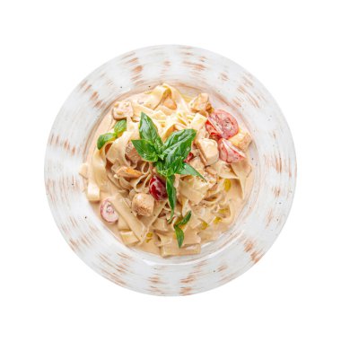 Isolated portion of fettuccine salmon cherry tomatoes creamy sauce 