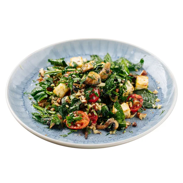 Isolated portion of salad with mushrooms and cheese