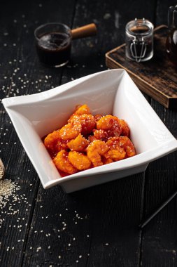 Portion of gourmet sweet and sour fried shrimp appetizer