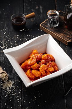 Portion of gourmet sweet and sour fried shrimp appetizer