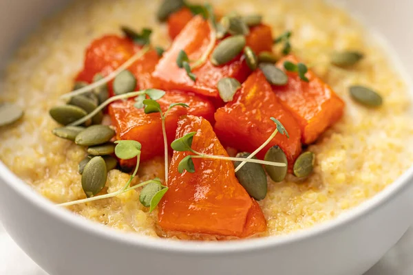 stock image Portion of healthy breakfast millet porridge with baked pumpkin