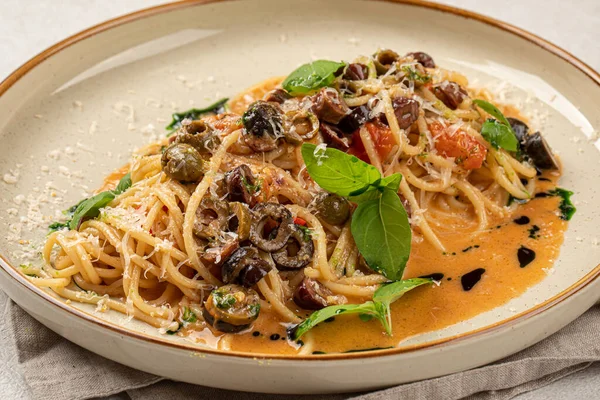 stock image Portion of gourmet pasta spaghetti with kalamata olives