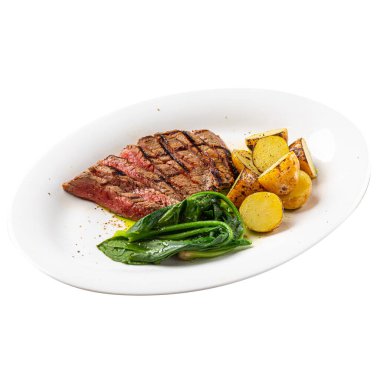 Izgara üst bıçaklı biftek, patates ve ıspanak.