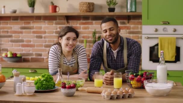 Charismatic Couple Multiethnic Posing Front Camera Kitchen Island Morning While — Vídeo de Stock