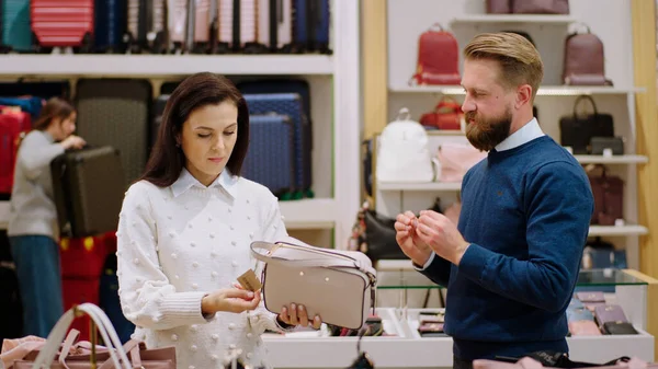 stock image Concept of small business and entrepreneur in the accessories store beautiful customer woman have a conversation with the salesman about the quality of bags.