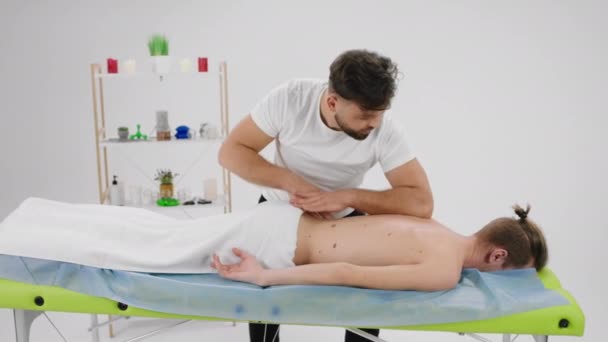 Large Massage Room Guy Have Relaxed Professional Back Massage Professional — Stockvideo