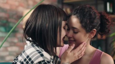 Young two ladies LGBT hugging each other and looking with romantic eyes to each other they fall in love concept of freedom equality friendship. 4k