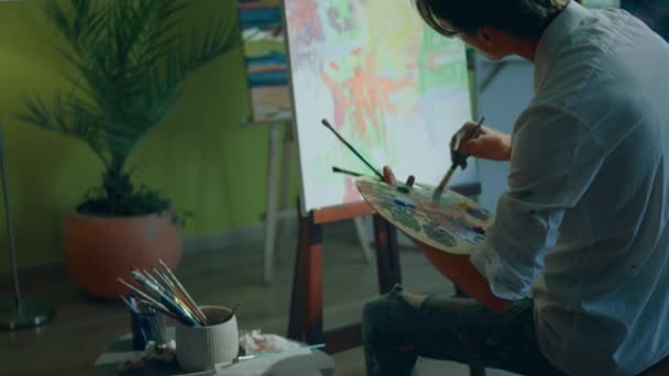 Young Artist Man Holding Colour Palette Hands Take Paint Brush — Vídeos de Stock