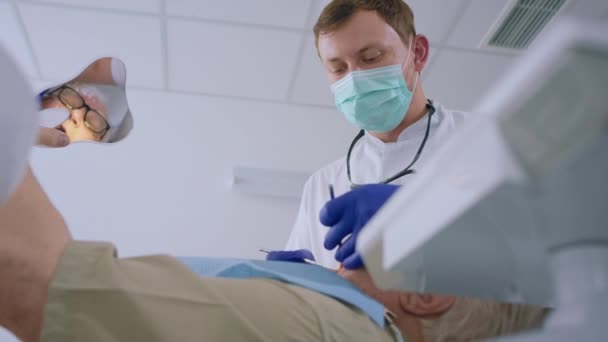 Dental Clinic Young Looking Dentist Man Doing Treatment Teeth Old — Stock videók