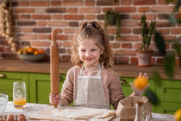 stock image I m front of the camera cute and pretty girl blowing the flour while preparing a delicious dessert at the kitchen island. Portrait