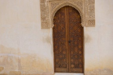 old wooden door in Alhambra palace in Granada, Spain