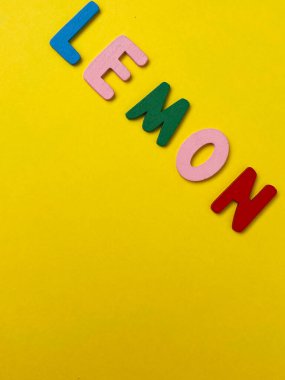 word lemon on yellow background