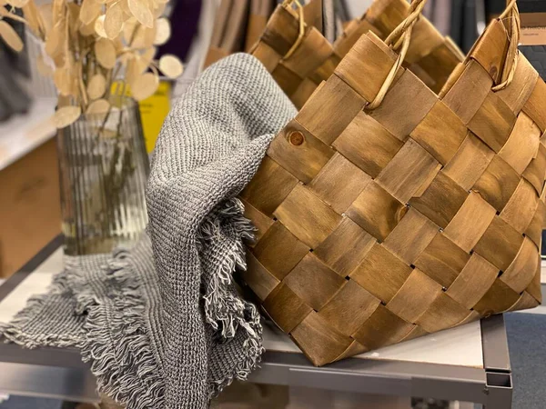 wicker basket with handmade blanket  in the store
