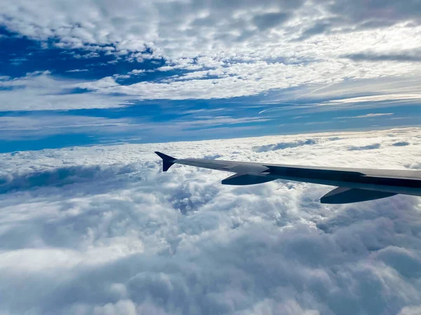 Stock image view from window of airplane flying through a white clouds