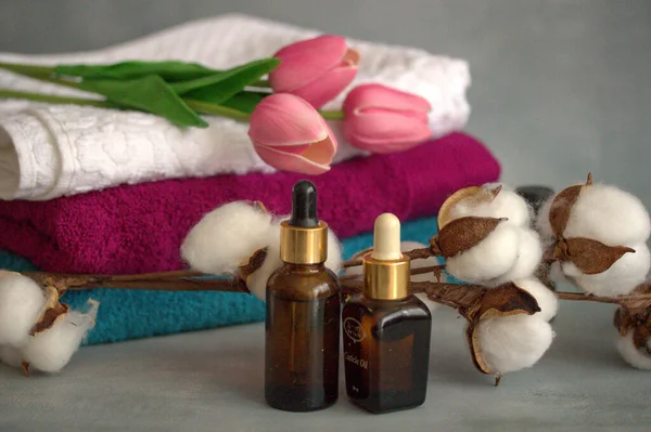 spa accessories with pink towel, soap, towels, orchid, and a branch of body
