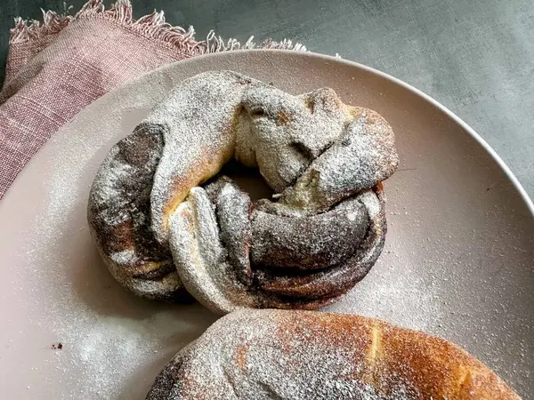 freshly chocolate pastry bread with powdered sugar