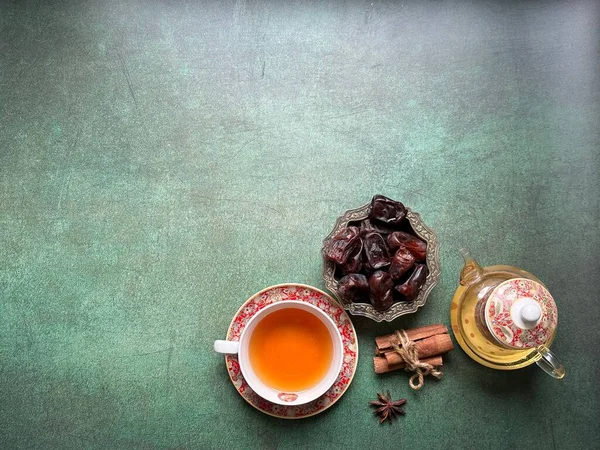 Ramadan food and drinks concept. A cup of tea with cinnamon and anise.