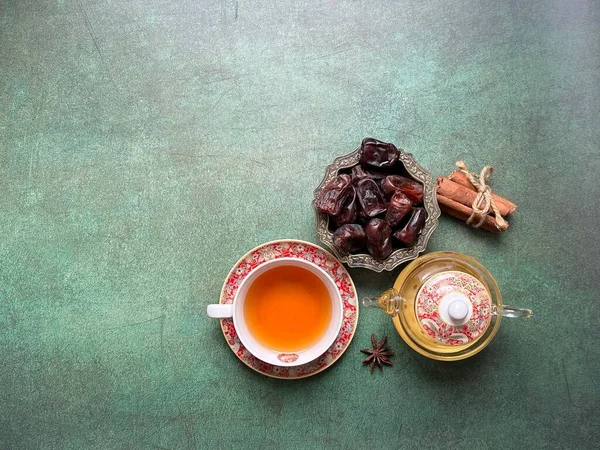 Ramadan food and drinks concept. A cup of tea with cinnamon and anise.