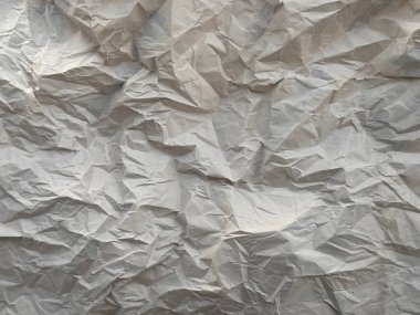 Buruşmuş kağıdın soyut arkaplanı. Buruşmuş kağıdın dokusu.