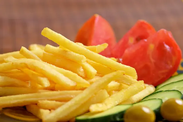 Close French Fries Cucumber Tomato Olives — Stock Photo, Image